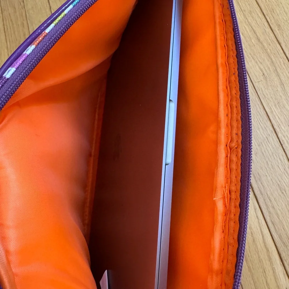 Striped Padded Laptop Sleeve - Multicolor with orange padded lining.